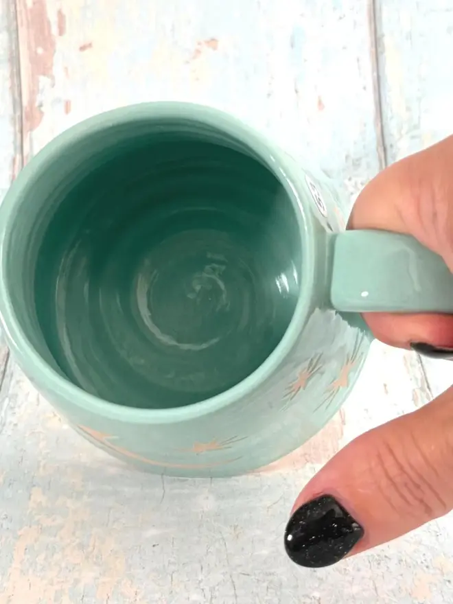inside turquoise star mug