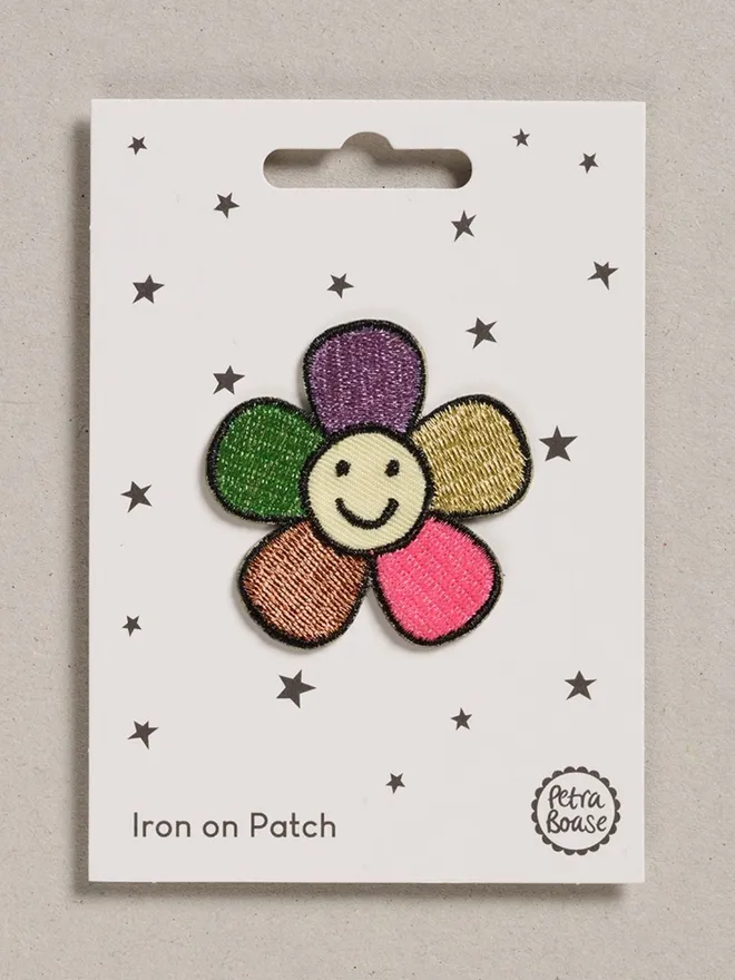 Retro happy flower iron on embroidered fabric patch. 