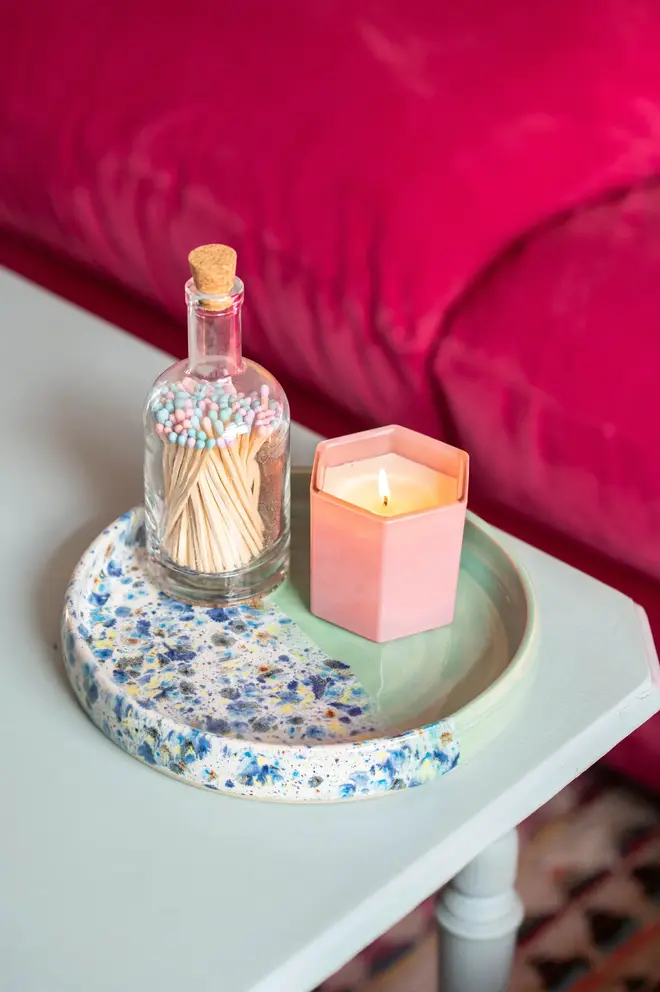 Shoreline Tray, a colourful tray placed on a table side accompanied by a candle and matches. 