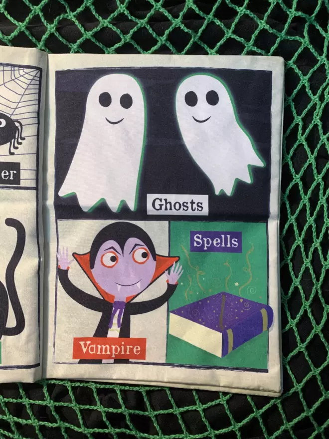 Halloween crinkly newspaper with two white ghosts a vampire and a purple book of spells