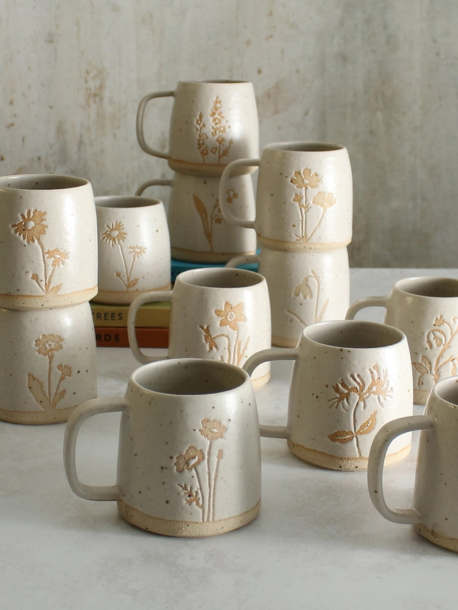 Variety of handmade birthflower mugs