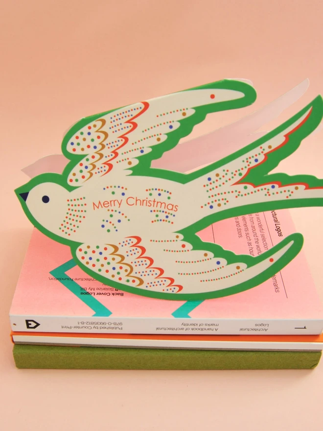 Die cut bird Merry Christmas card.
