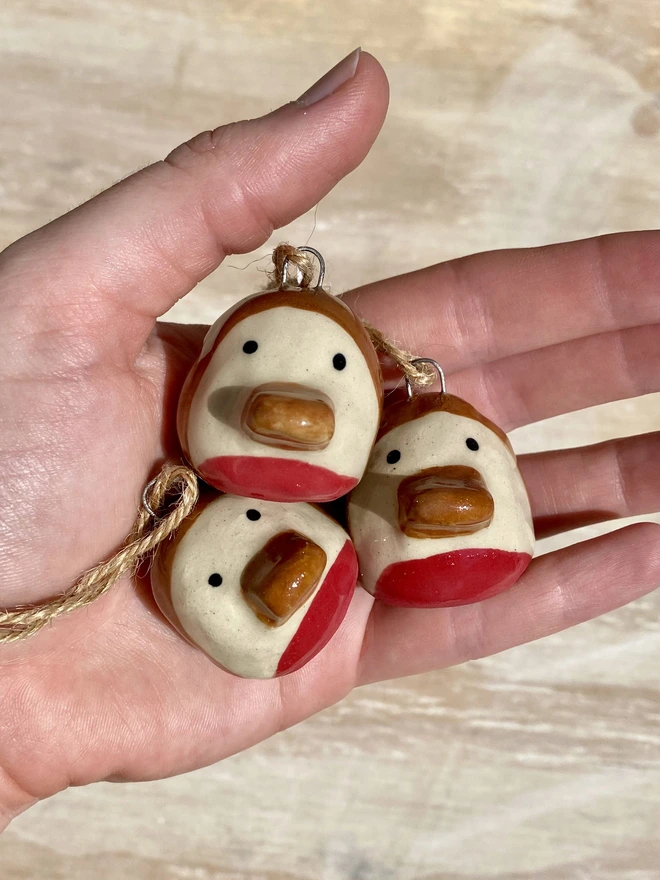 ceramic robin hanging decoration - group - held