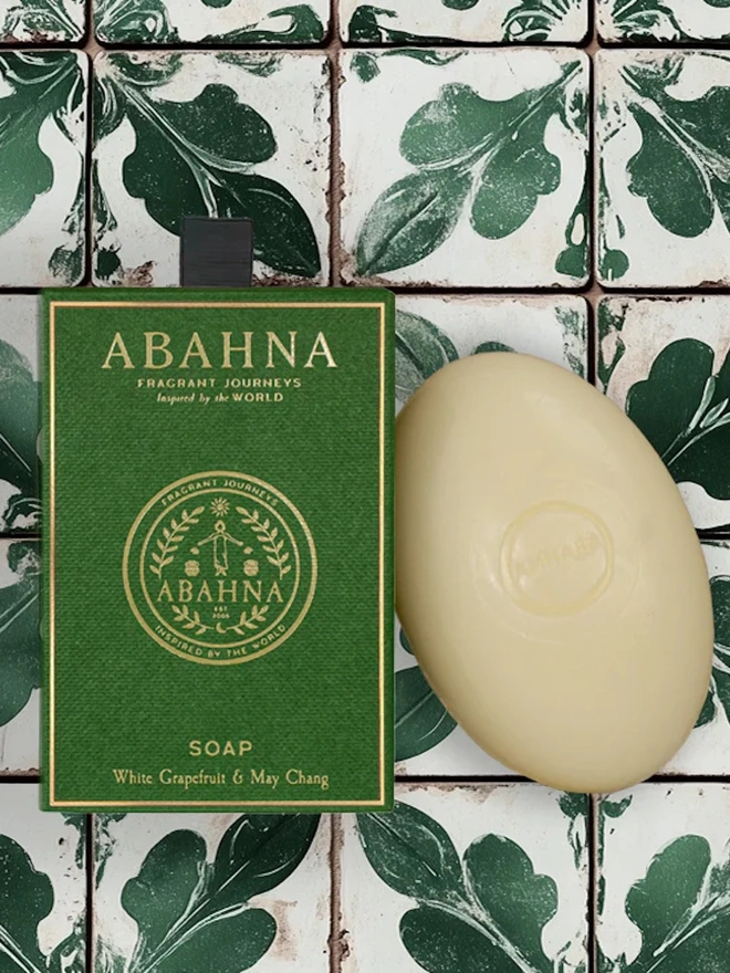 abhana soap in white grapefruit scent. green box next to white bar of soap