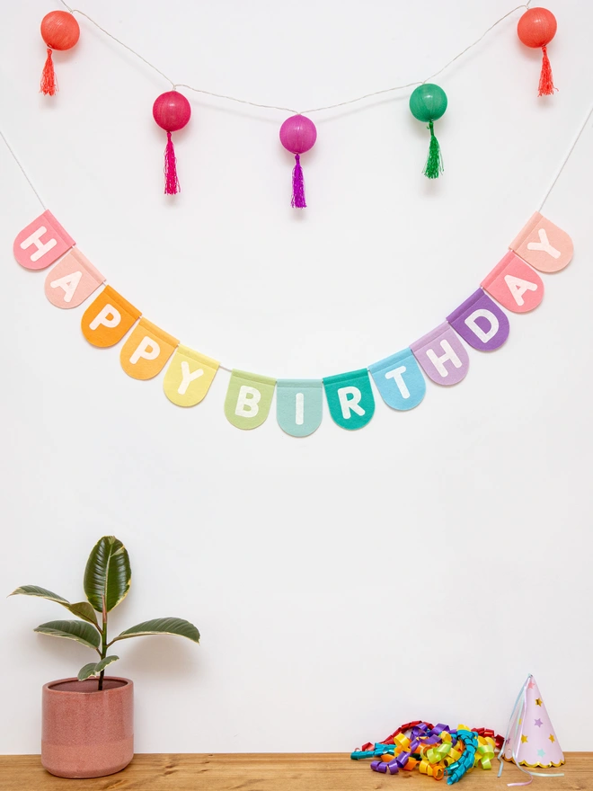Happy birthday bunting in pastel rainbow colours