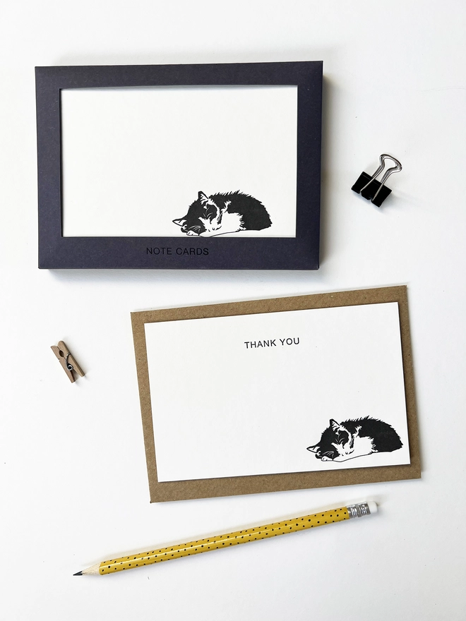 Boxed flat correspondence cards illustrated with a sleeping cat