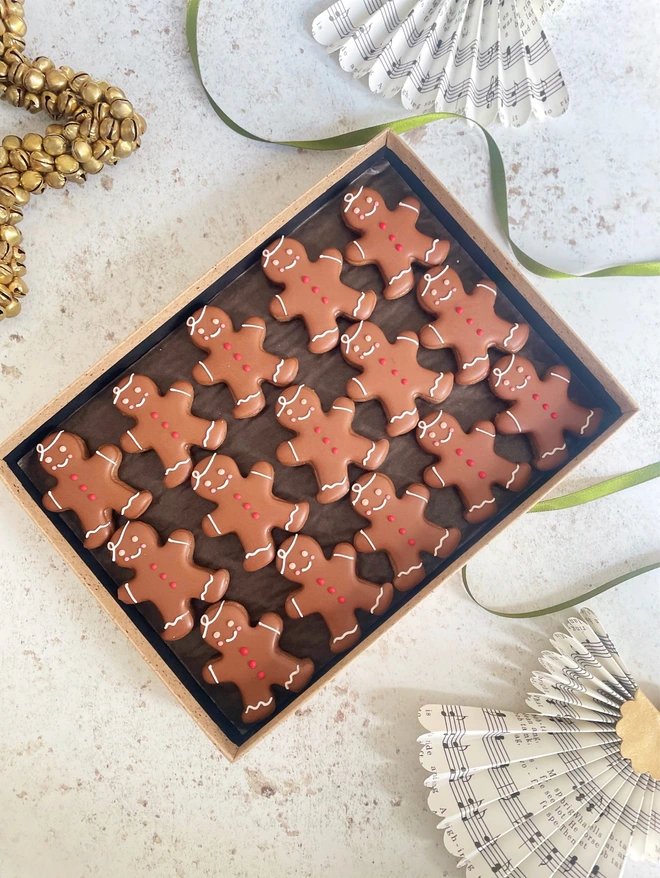 Hand-decorated gingerbread men biscuits in a luxury gift box, festive Christmas spiced cookies ideal for gifting