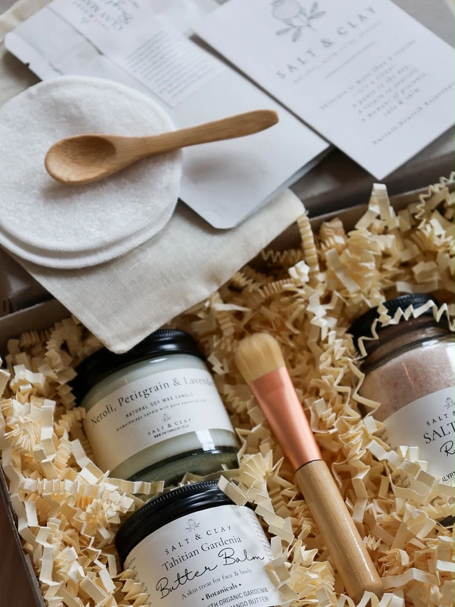 Skincare and bath products as part of the SALT & CLAY Spa At Home Gift Set.