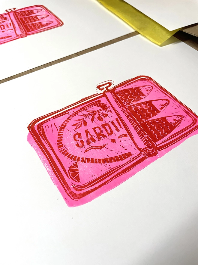 Vintage style Sardine tin hand lino printed in bright neon and red 