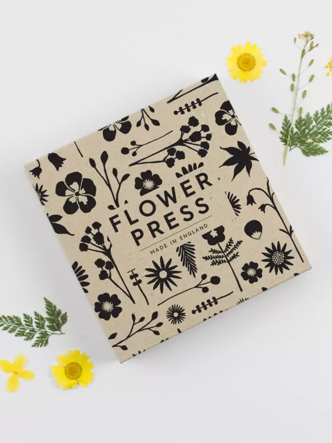 Flower press packaging in full cover floral illustration.