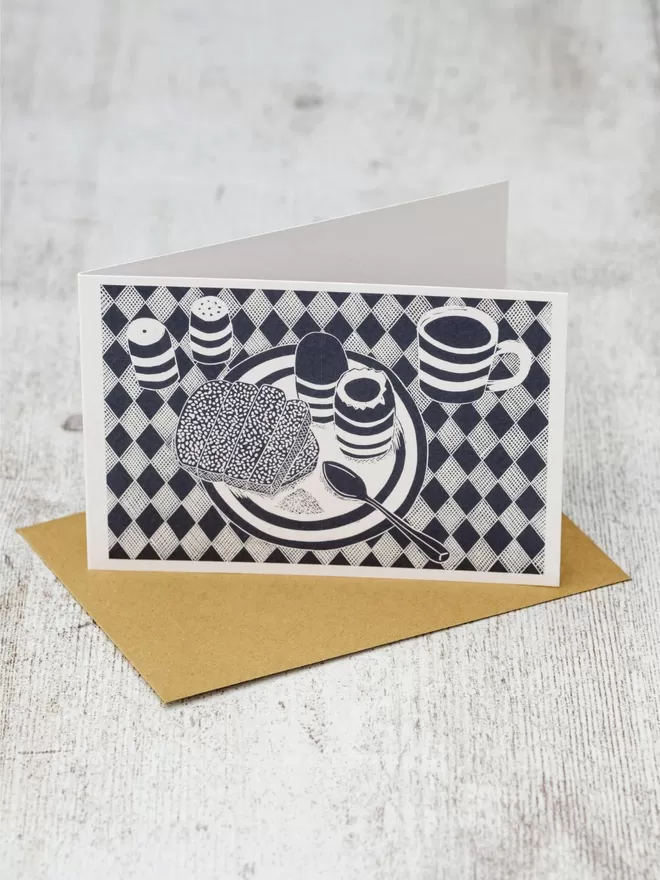 Greeting Card with an image of Boiled Egg & Soldiers on a plate with drink and salt & pepper on the table, taken from an original lino print