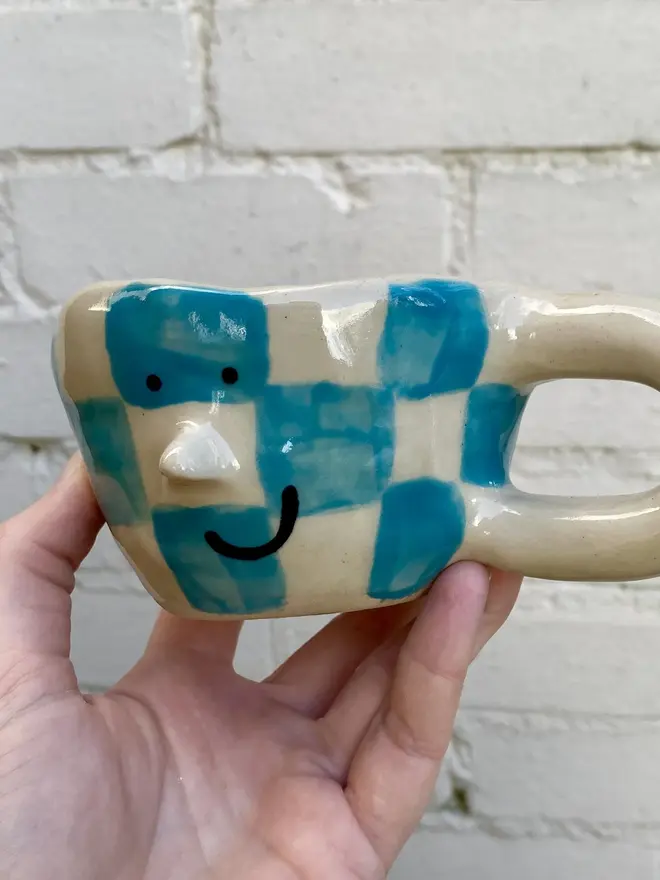 blue white check handmade ceramic smiley face mug