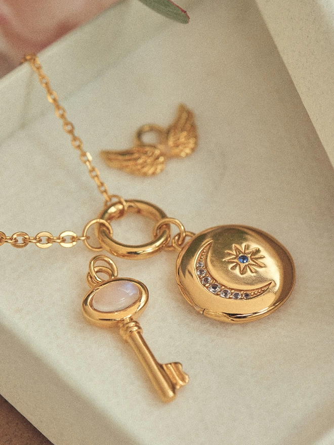 gold necklace with pendants and charms