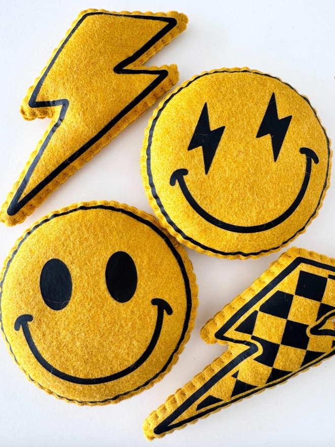 Smiley Face and Lightning Bolt Decoration. All the products available, seen in mustard