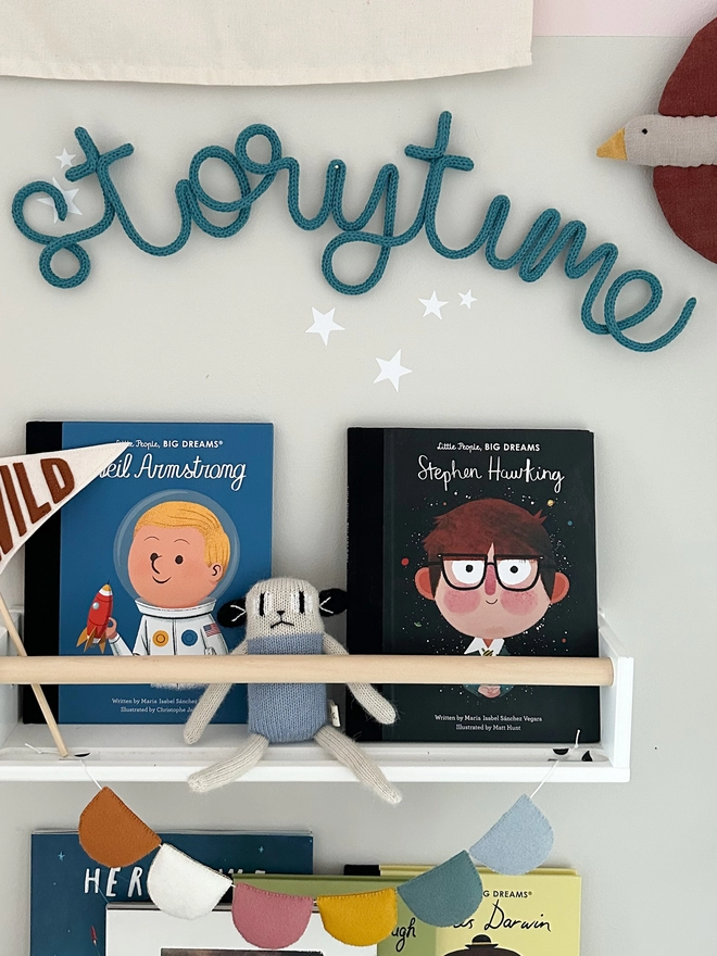 "storytime" sign hanging up above kids book nook, reading area 