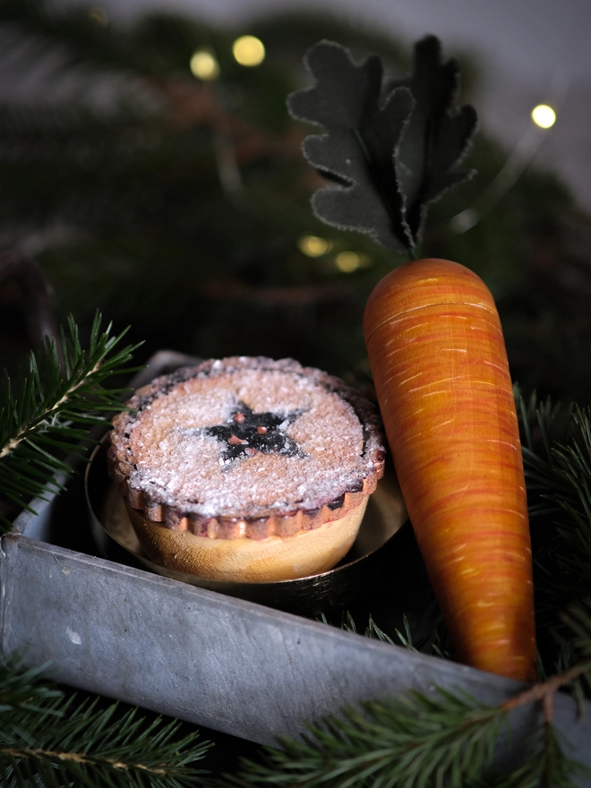 A festive handpainted wooden mince pie designed to become part of your family’s Christmas Eve tradition, with a special place for a note to Santa.