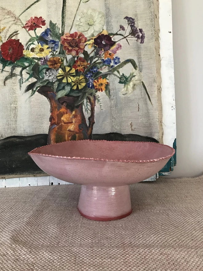 rose pink pedestal bowl with small scalloped edge