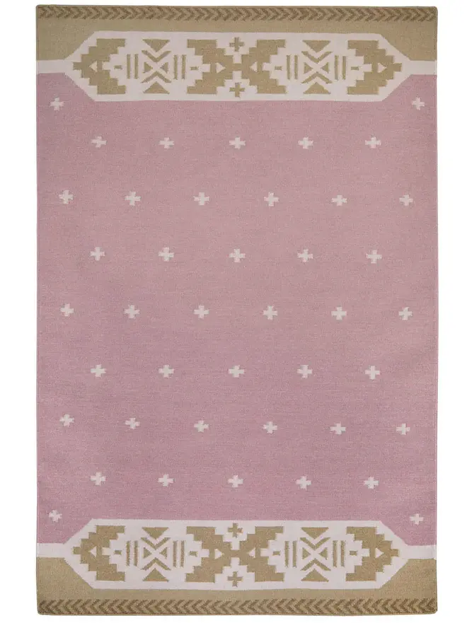 Manali Flatweave Rug, a colourful rug sitting on a plain surface. 