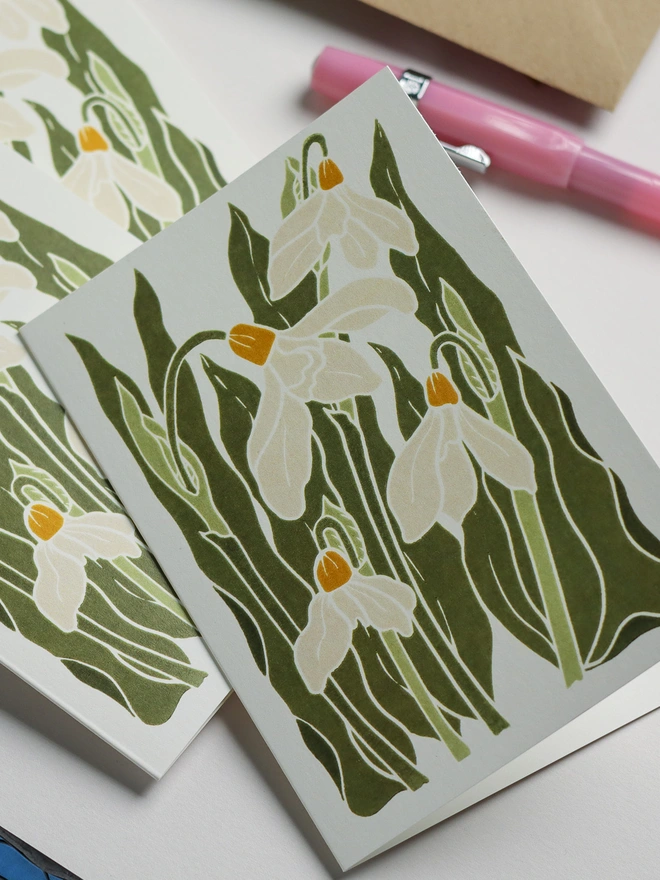 Hand-carved winter snowdrop notecard, one design from botanical stationery set. Linocut print in classic cream and greens on A6 recycled cardstock. Contemporary cottagecore greeting card 