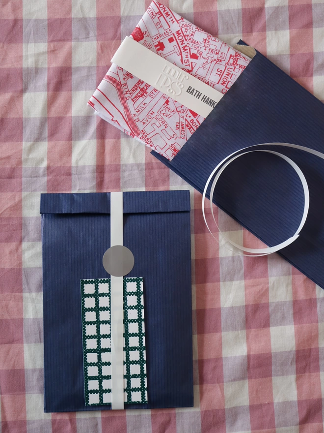A Mr.PS Bath hankie with optional gift wrapping; navy paper, white ribbon and patterned gift card