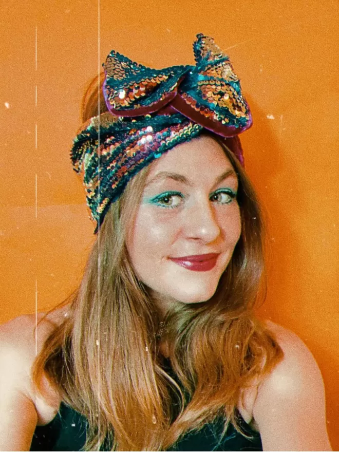 Rock The Jumpsuit Blue & Gold Denim Headwrap model wearing with funky 70s makeup in a selfie style
