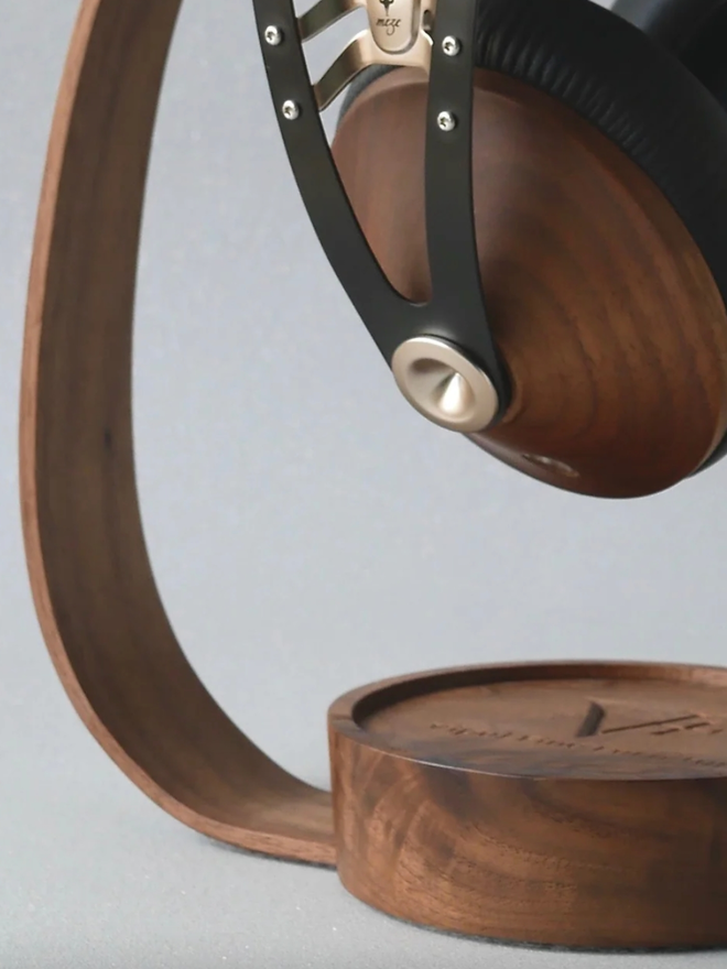 The Band Wooden Headphone Stand. A close up of a headphone stand in Walnut.