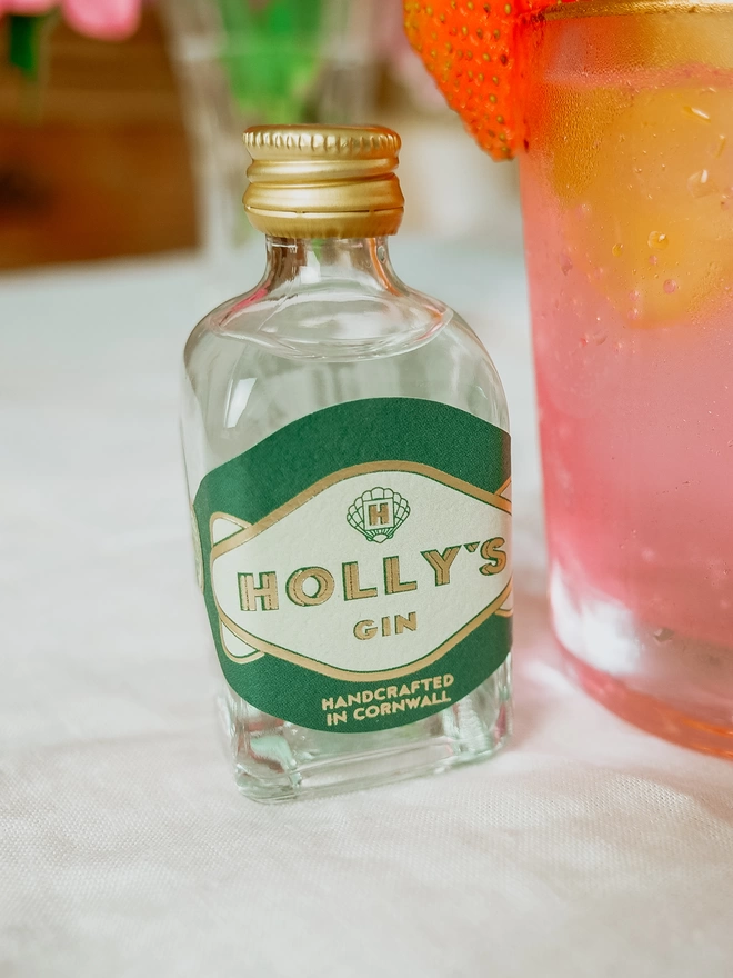 Holly's Gin miniature green and gold label