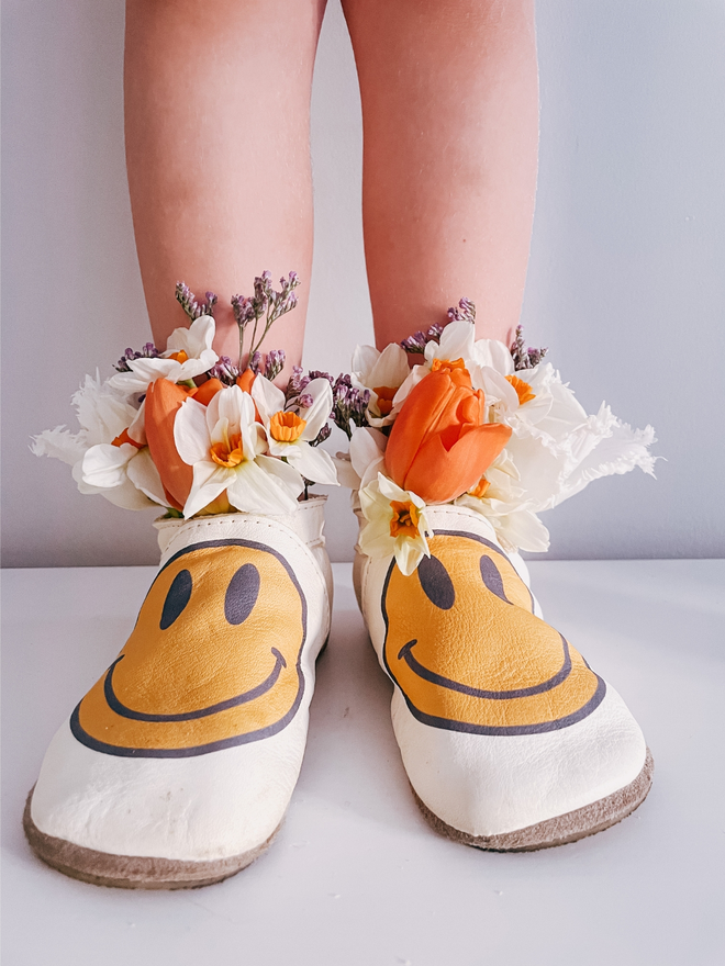 yellow smiley face baby shoes