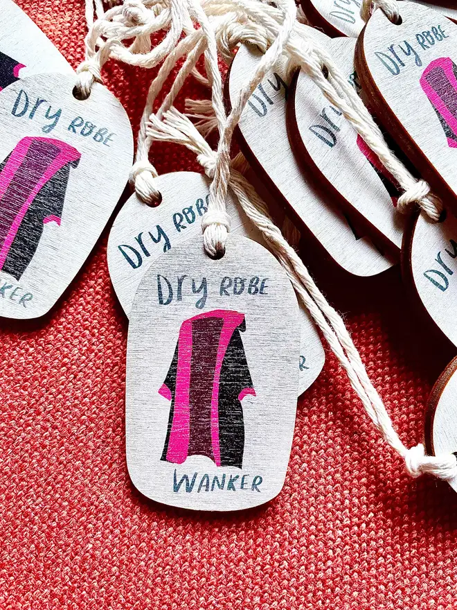 Wooden ornament reads 'dry robe wanker'