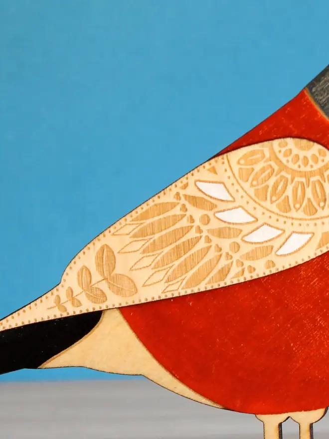 Standing Wooden Chaffinch, red wooden bird decoration standing on a platform. 