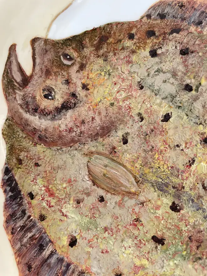 detail of Oil Painted Swimming Plaice On A vintage Cake Plate.
