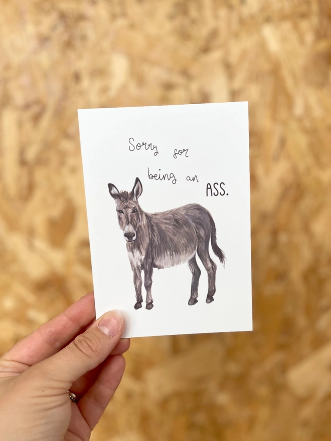 a greetings card featuring a donkey (or ass) with the phrase “sorry for being an ass”