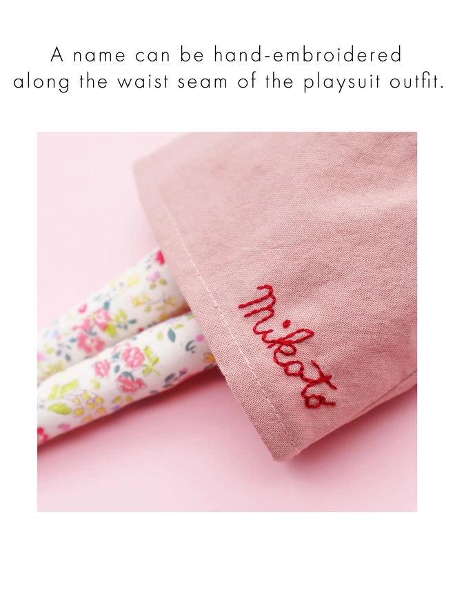 hand embroidered name on a doll's dress