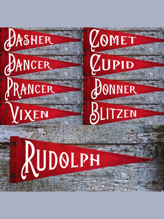 Nine red pennant flags with Santas Reindeer names on each in ivory. Dasher, dancer, prancer, vixen, comet, cupid, Donner, blitzes and Rudolph