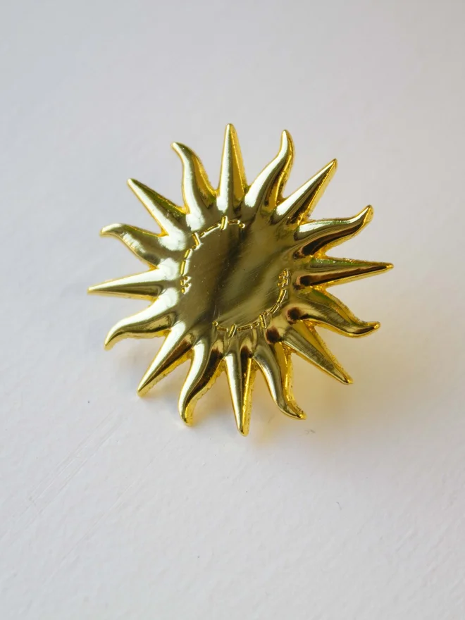siren sun spinning enamel pin