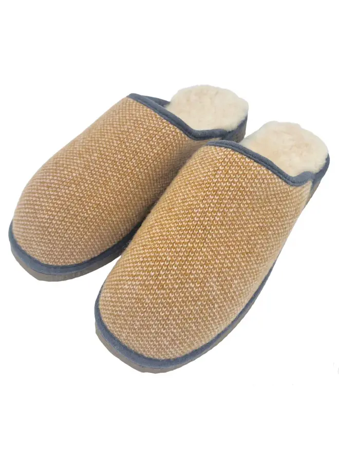 Women's Lambswool & Sheepskin Slippers, a pair of colourful slippers sitting on a white plain surface. 