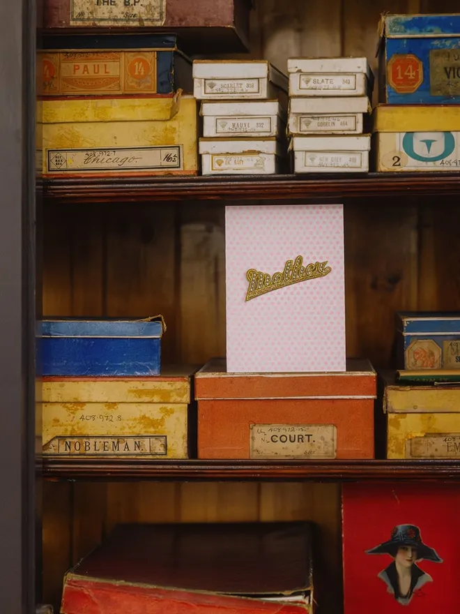 Mothers Day and birthday card with removable iron on mother patch in a vintage cuboard.