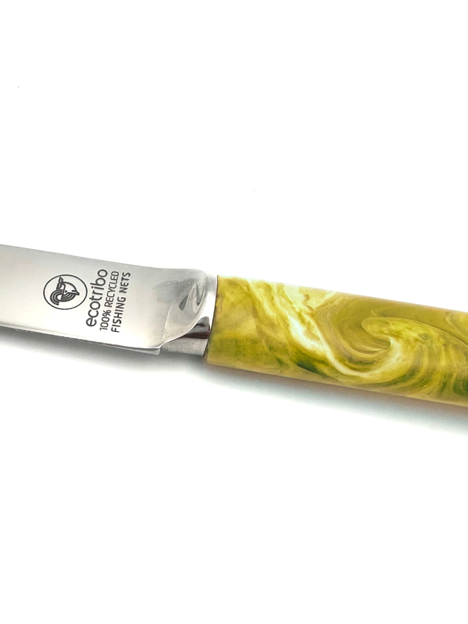 Sustainable cheese knife made from recycled ocean plastic with a unique marbled finish, handcrafted in Britain.