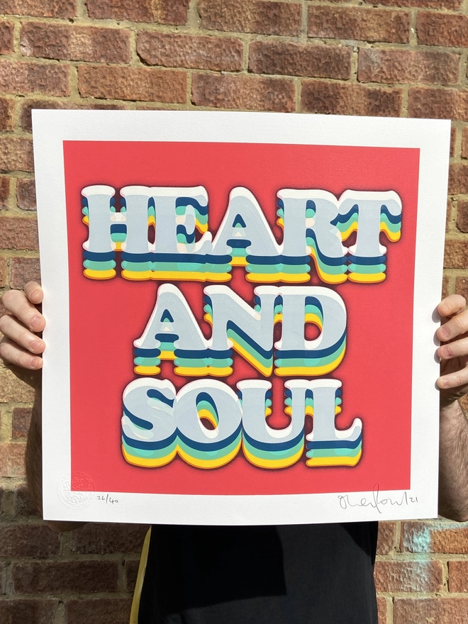 "Heart & Soul" Hand Pulled Screen Print on a red background with rainbow printed typography that says heart and soul 