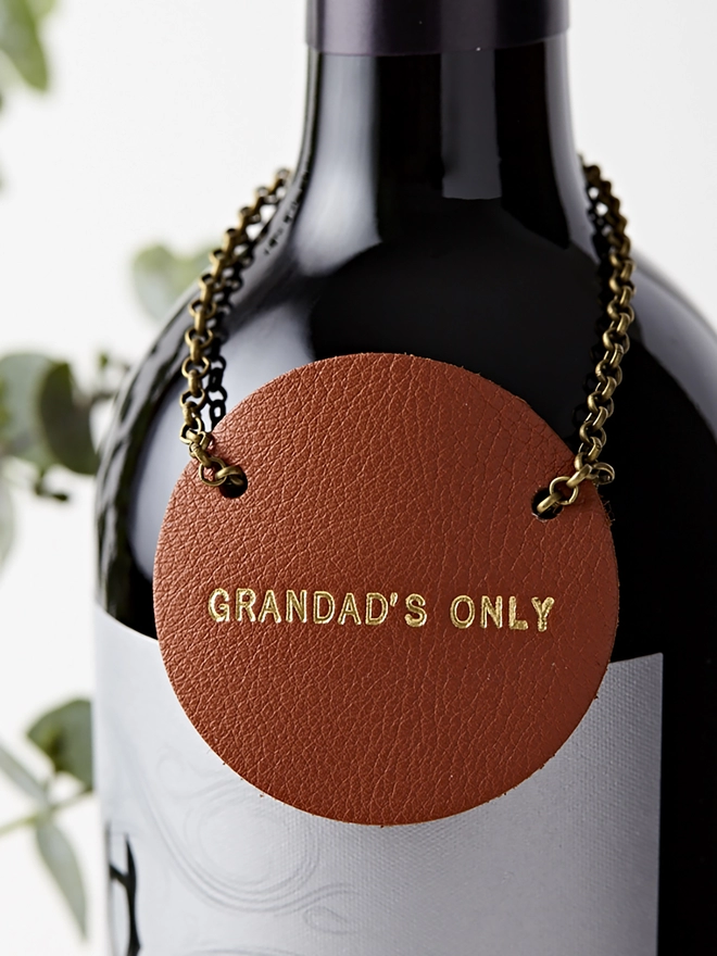 Only for Grandads, tan leather tan for a wine bottle.