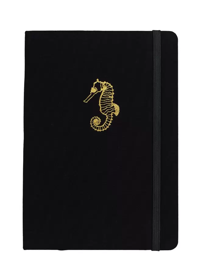 black notebook gold seahorse