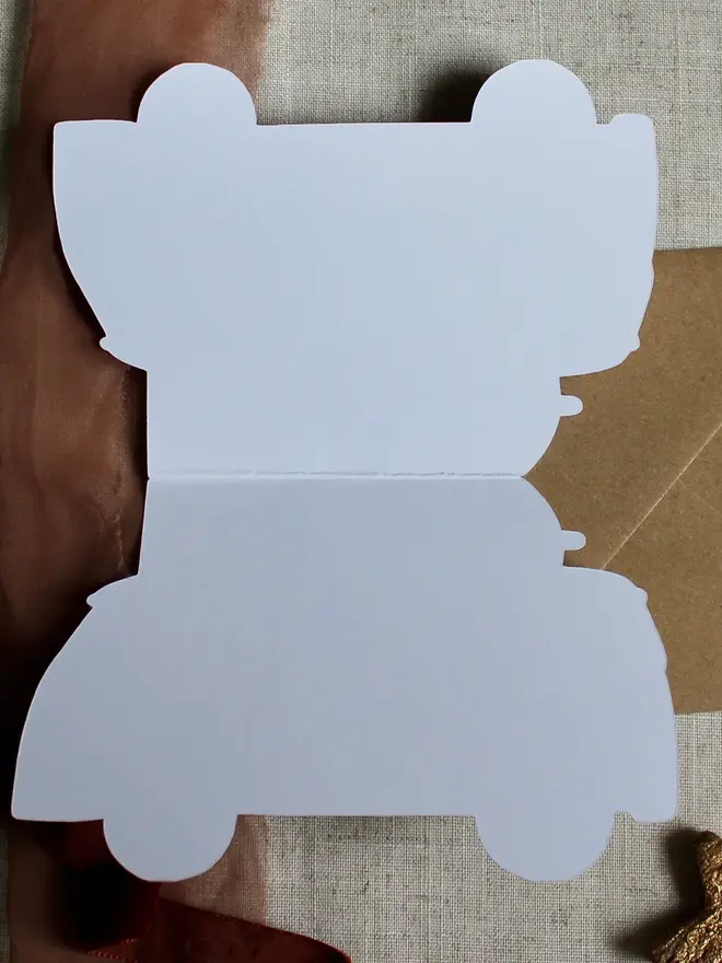 merry christmas illustrated campervan card. campervan shaped card open to show blank inside