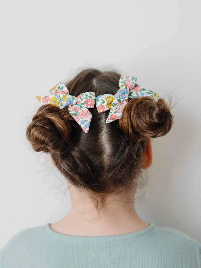 Girl with two liberty floral hair clips