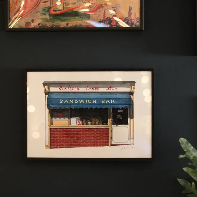 Clerkenwell Scotti's Snack Bar Giclée Print (Unframed), a print of a snack bar sitting against a navy blue backdrop joined by other prints. 