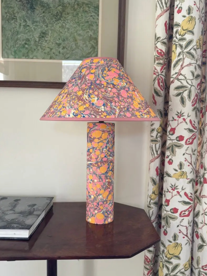 Marbled on Marbled Base & Shade. A peach lampshade and base on a table.