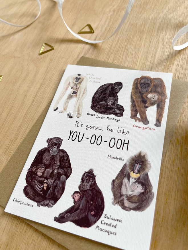 A greetings card featuring six different monkeys or apes with their babies, surrounding the phrase “it’s gonna be like you-oo-ooh”