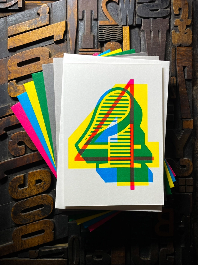 4th birthday anniversary milestone typographic letterpress card with deep impression print. Very colourful and vibrant. They show slight colour variations adding to the style anding to the charm of this handmade greeting card.