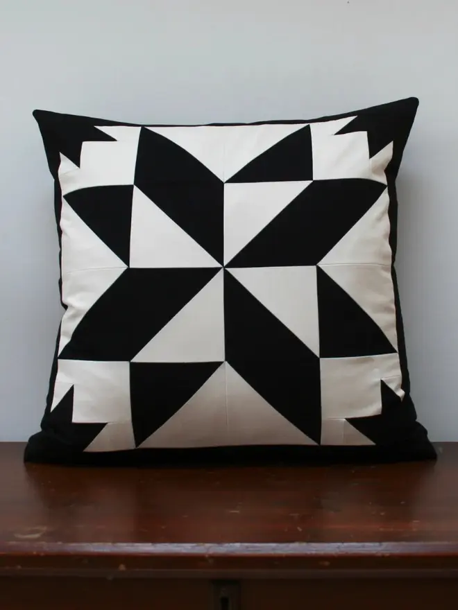 Celest At Night Patchwork Cushion, on a desk, 