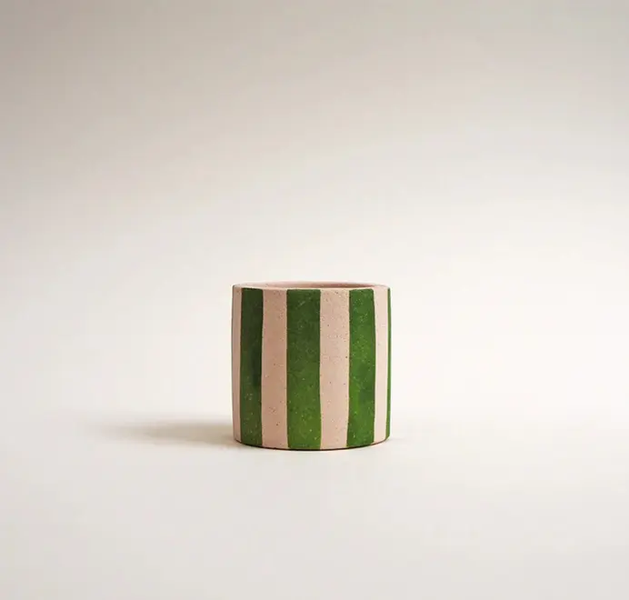 Mini Stripy Plant Pot. A white ceramic pot with vertical coloured stripes set against a plain light background.