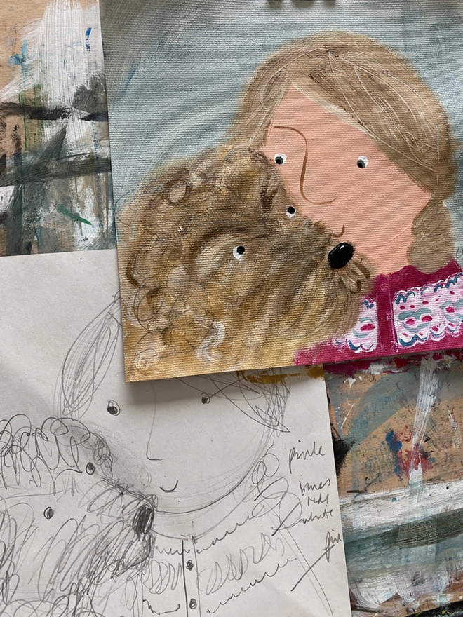 drawing board with portrait of girl and her pet dog in progress